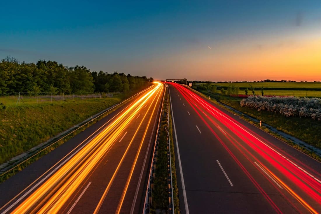 Light trails on a highway at sunset, symbolizing speed and efficiency—just like Premier Autos Detailing’s expert car cleaning services in West Plains, MO.