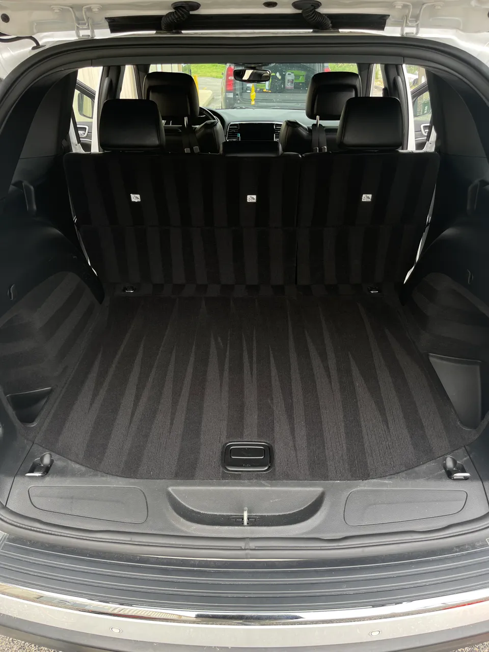 Fresh vacuum lines in the cargo area of a Jeep Grand Cherokee after detailing, West Plains MO