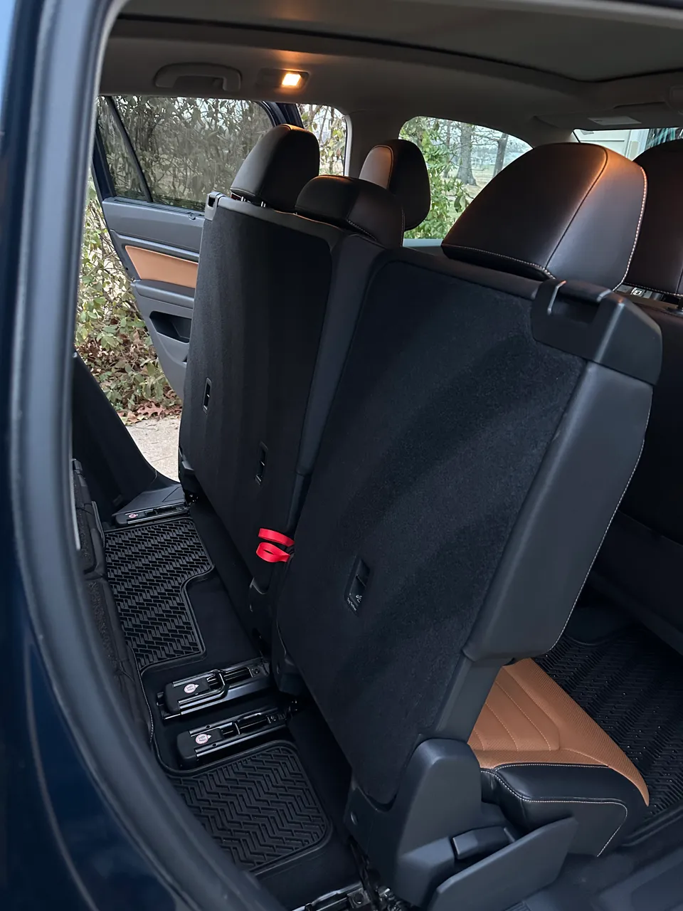 Spotless tan leather rear seats in a VW Atlas after detailing in West Plains, MO