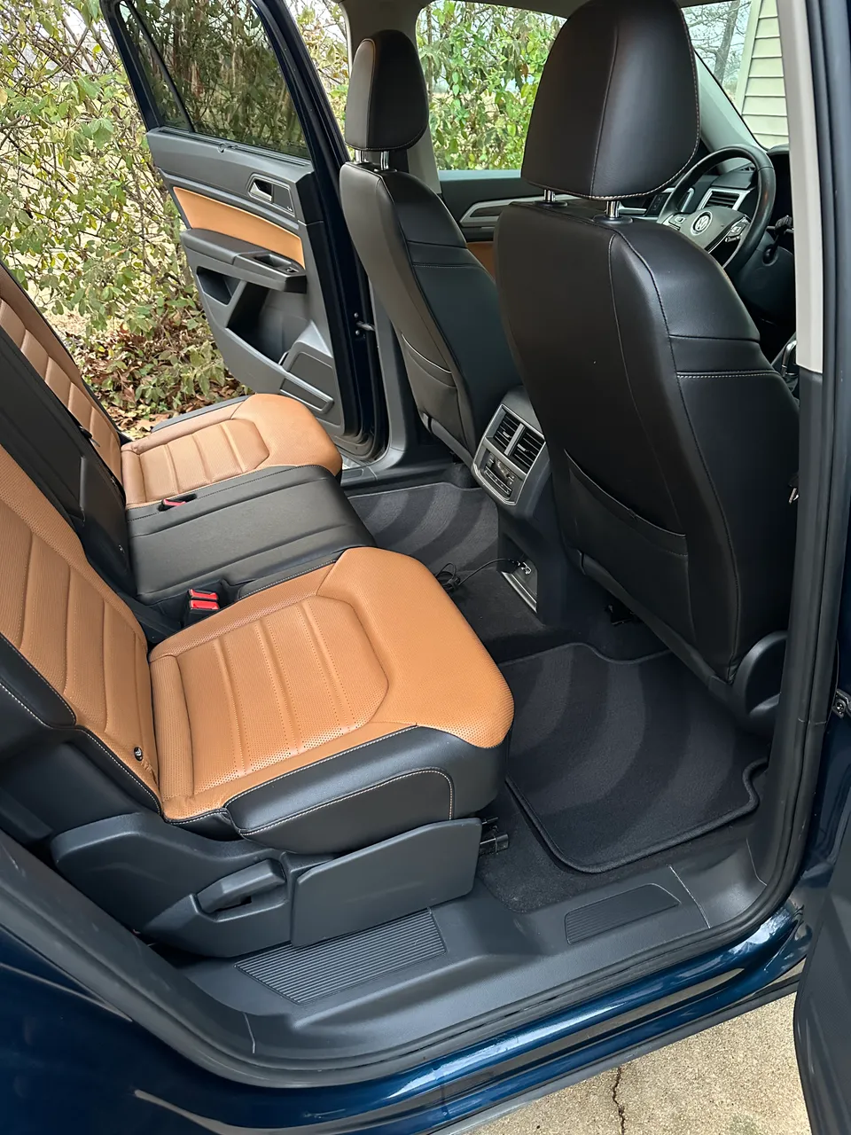 Tan leather second-row seats in a VW Atlas after interior detailing, West Plains MO