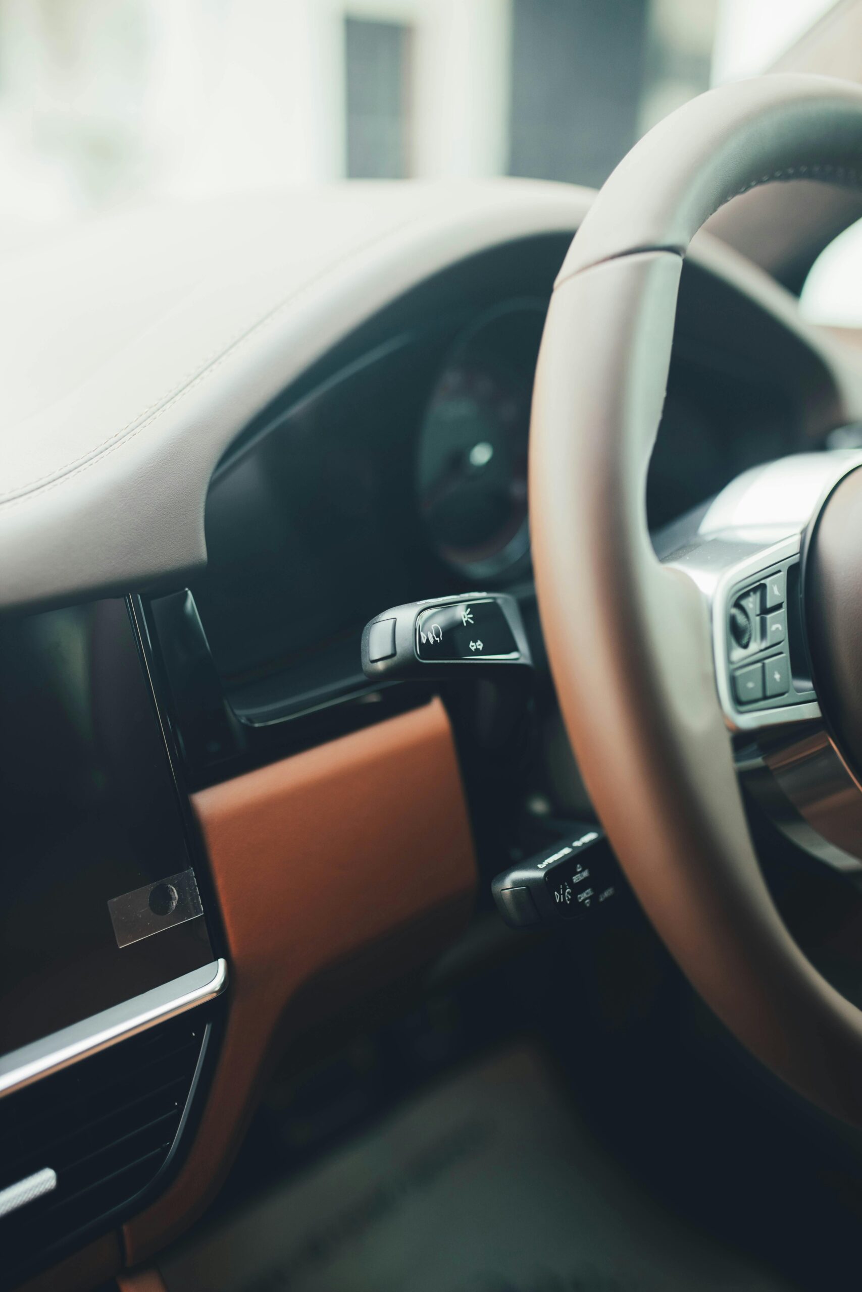 "Clean interior view of a car's steering wheel after professional odor removal by Premier Autos Detailing."