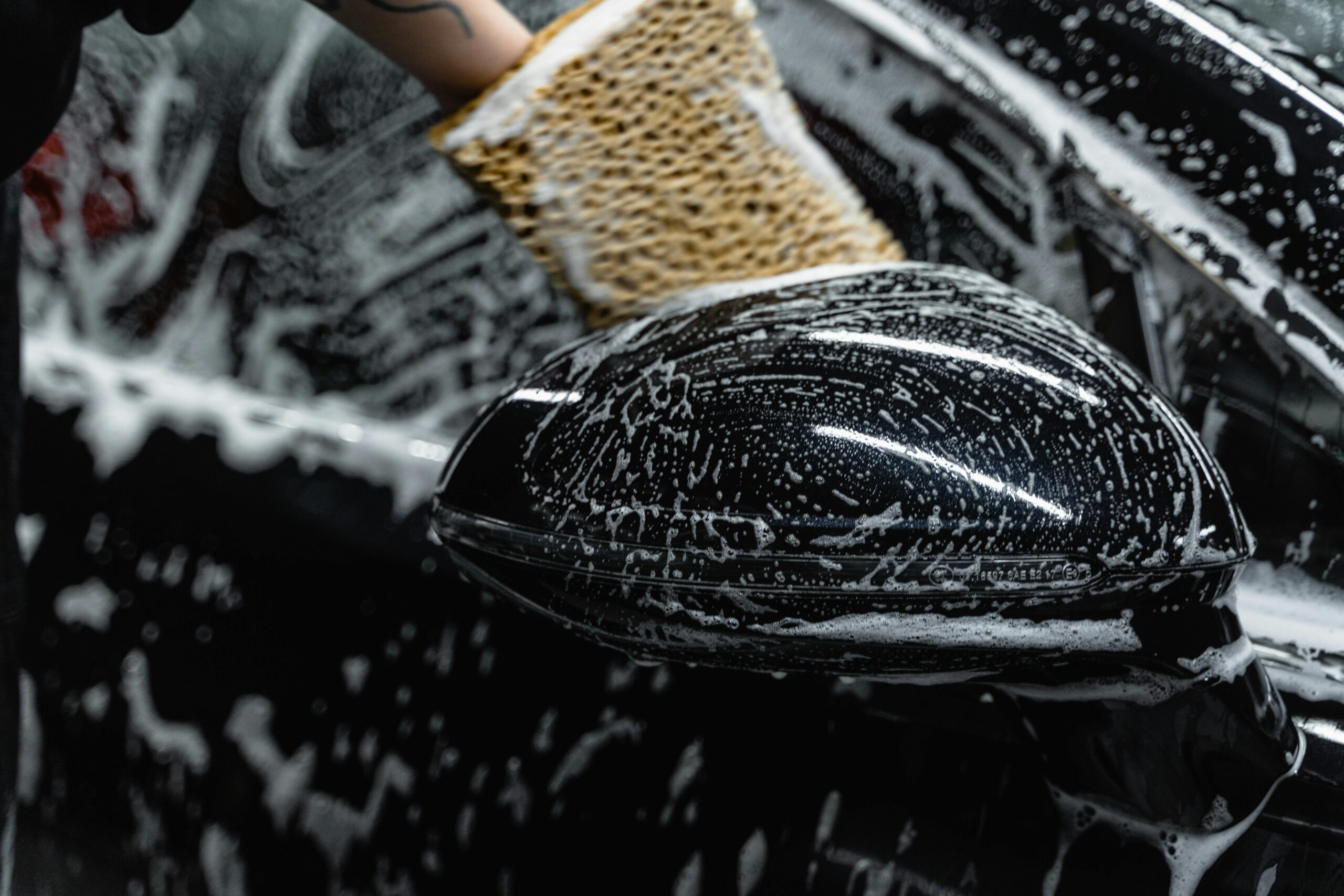 pexels-tima-miroshnichenko-6872146 "Black car covered in rich car shampoo during a professional wash, showcasing meticulous attention to detail by Premier Autos Detailing in West Plains, MO."