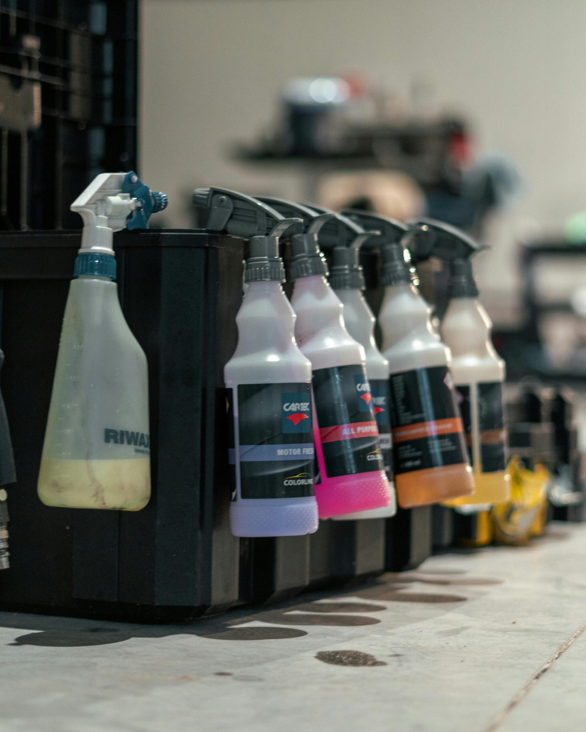 pexels-moonlightshotz-11139243 Box of detailing cleaner spray bottles for car care
