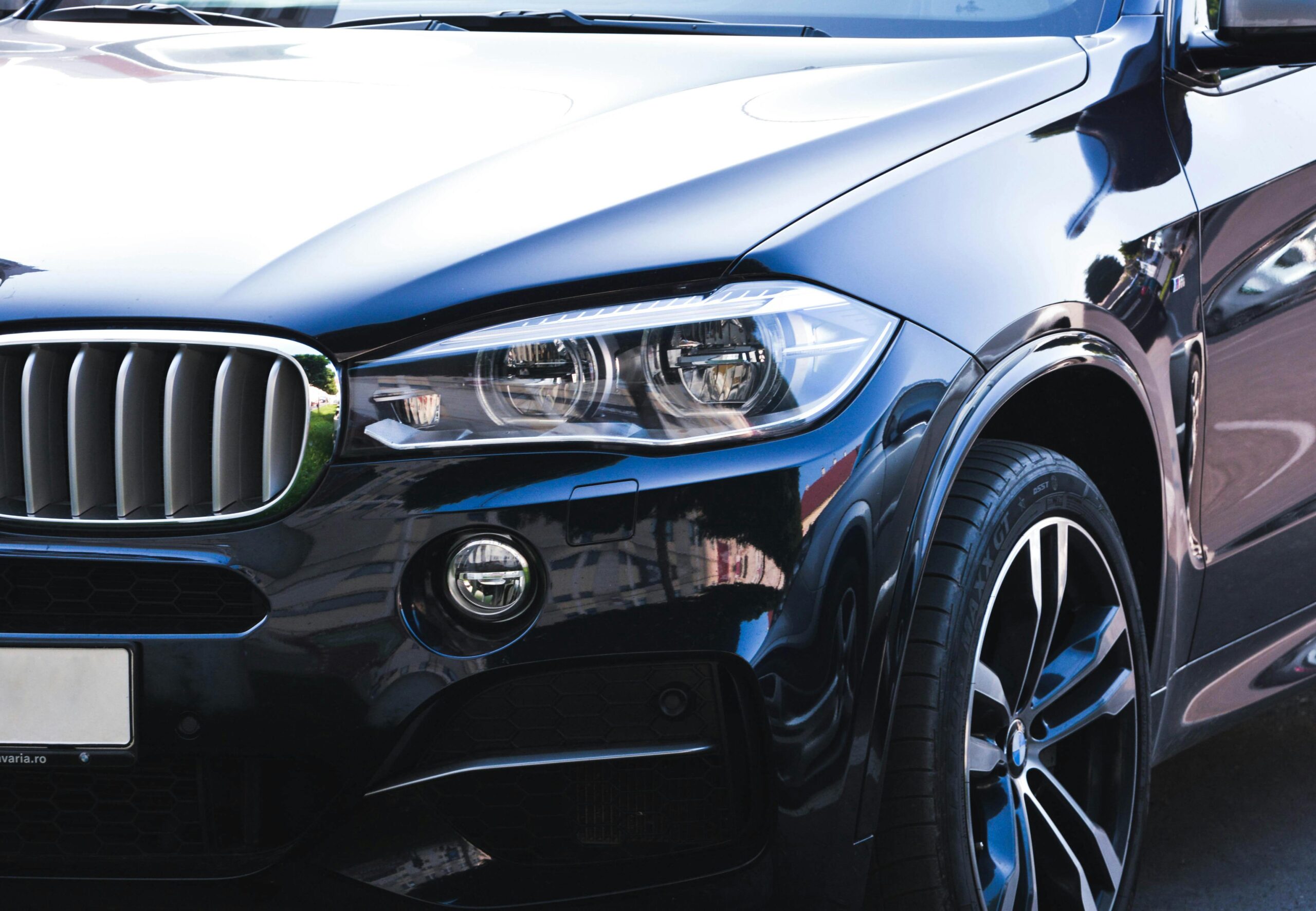 pexels-mcraftpix-21011 Close-up of a clean luxury SUV front end after professional detailing